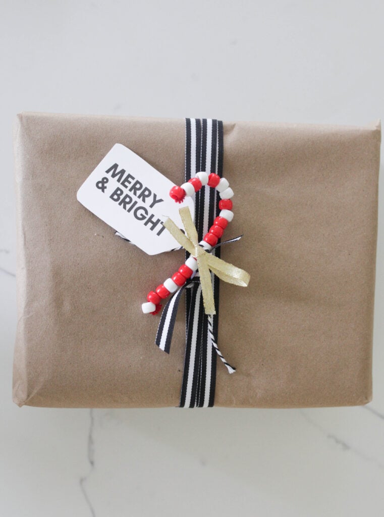 Pipe cleaner candy canes wrapped around a Christmas present