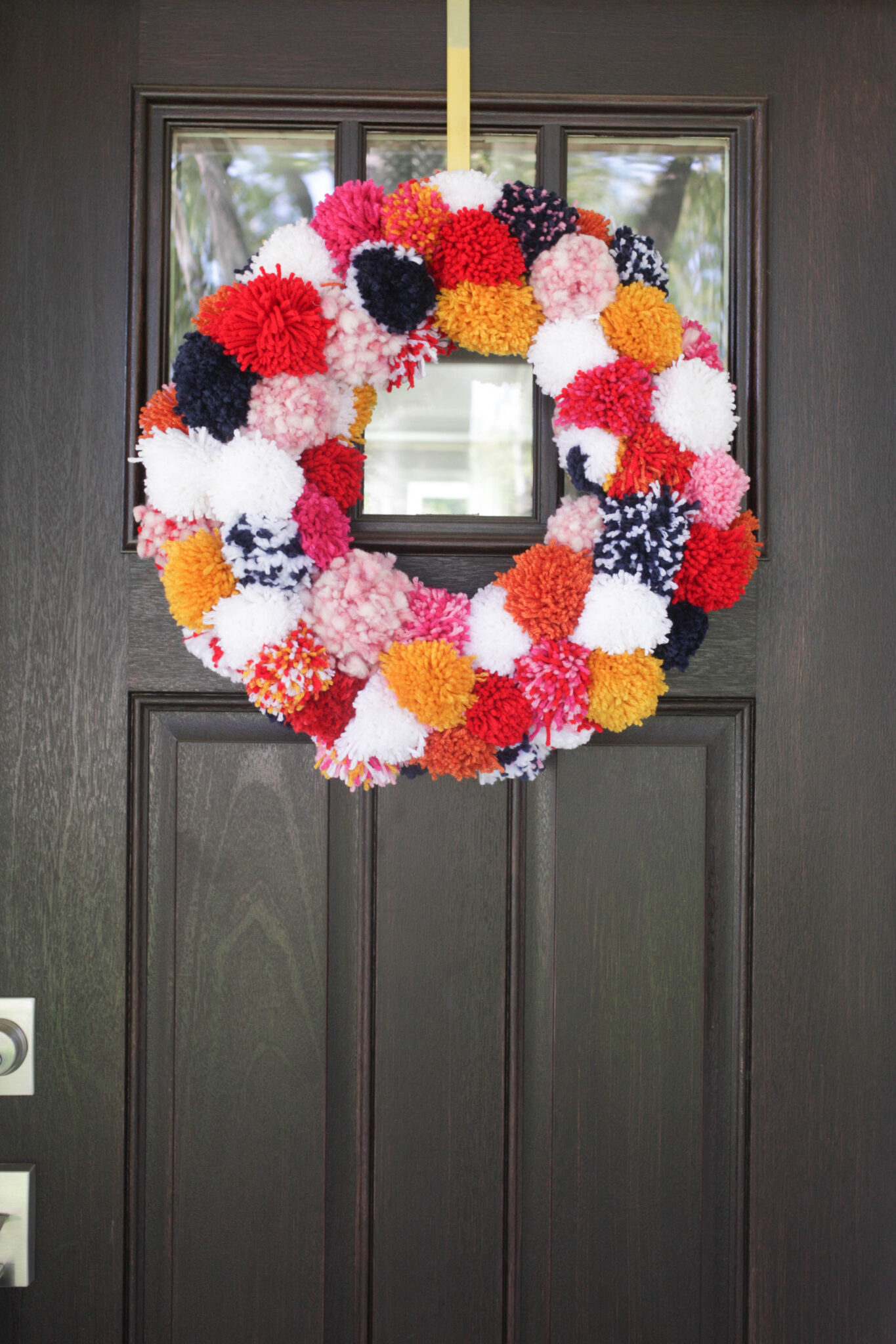Pom pom wreath on door