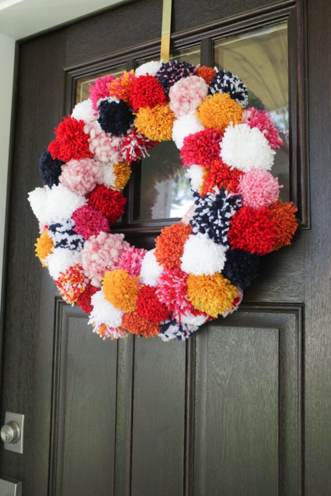 Pom pom wreath on door