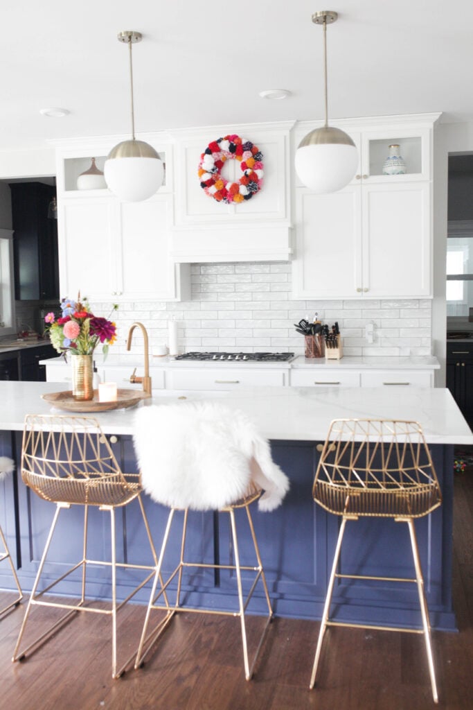 Kitchen with pom pom wreath on vent hood