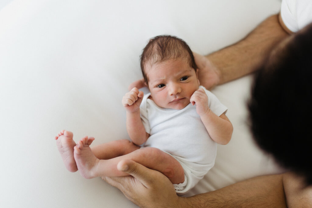 Newborn in dad's hands