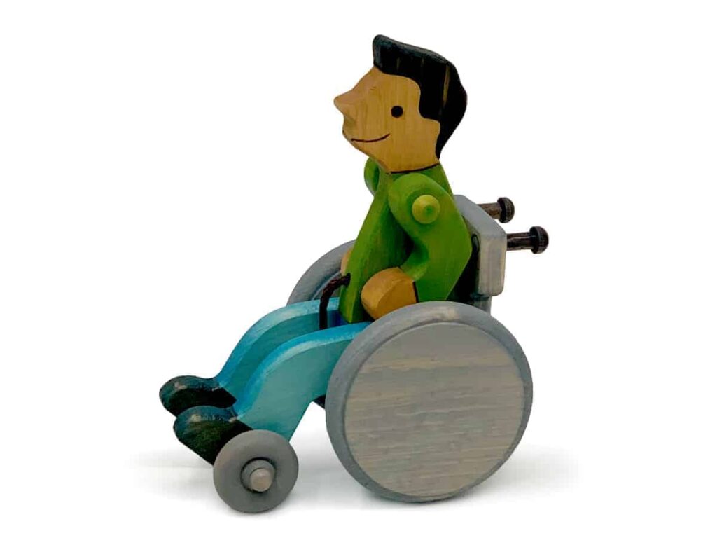 Lark Toys wooden toy boy in a wheelchair
