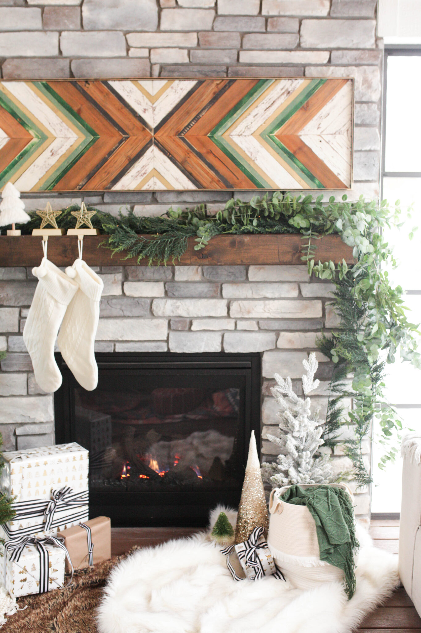holiday decor - mantle with greenery, stockings and fireplace