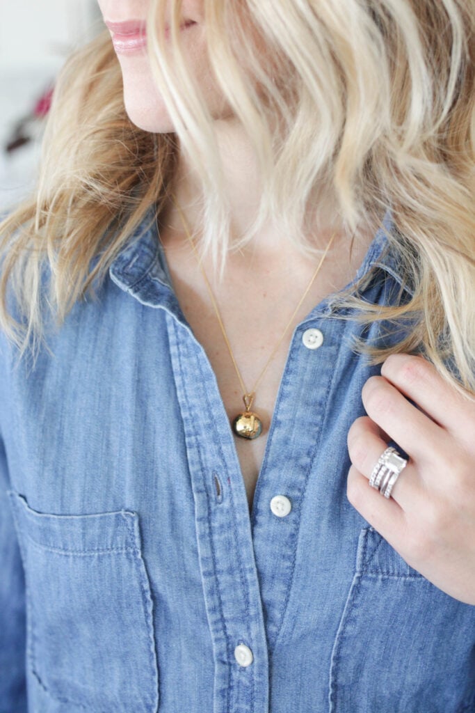 Woman wearing gold locket