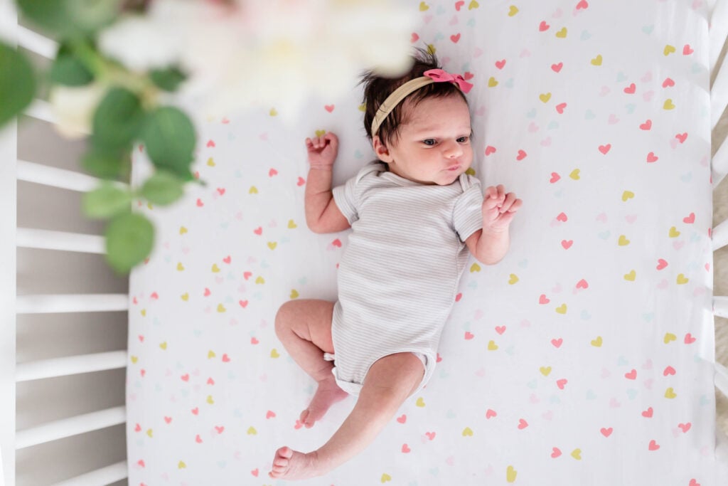 Newborn in crib