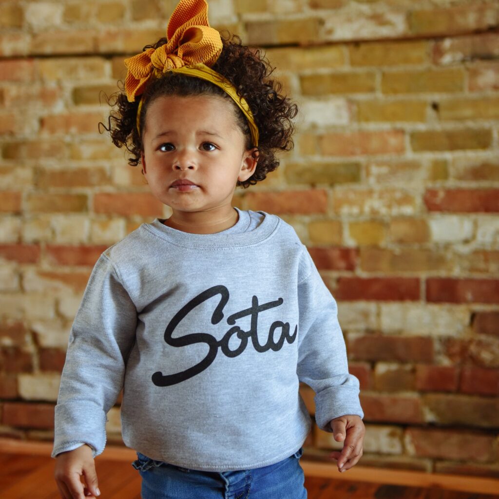 Toddler in Sota sweatshirt