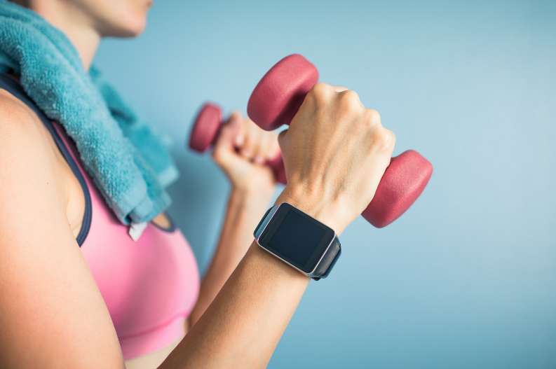 Woman using handweights