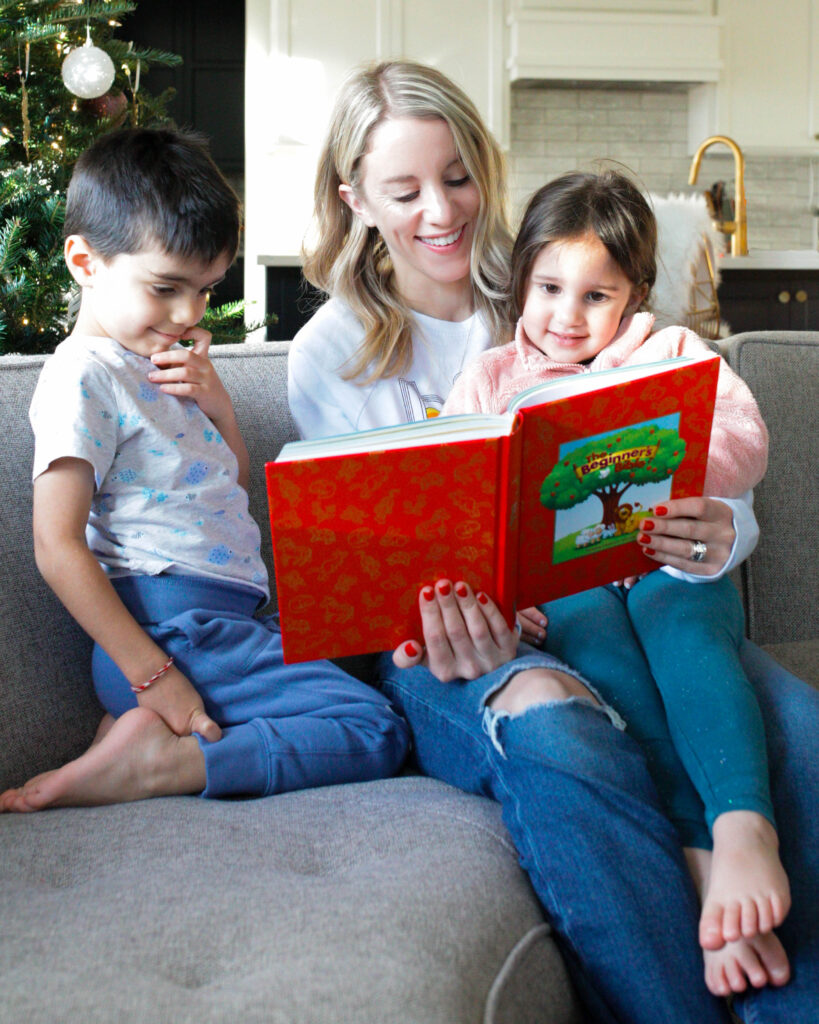 Woman reading Beginner's Bible to two kids