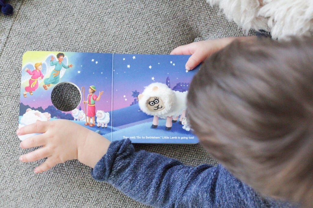 Girl reading Little Lamb's Christmas