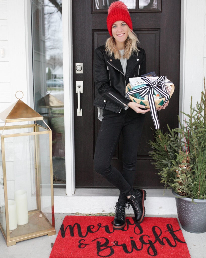 Woman on front porch with gift basket