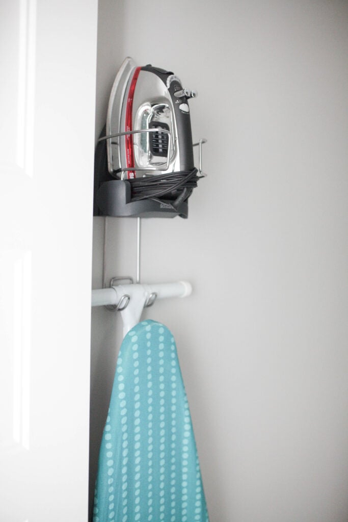 Ironing board and iron holder