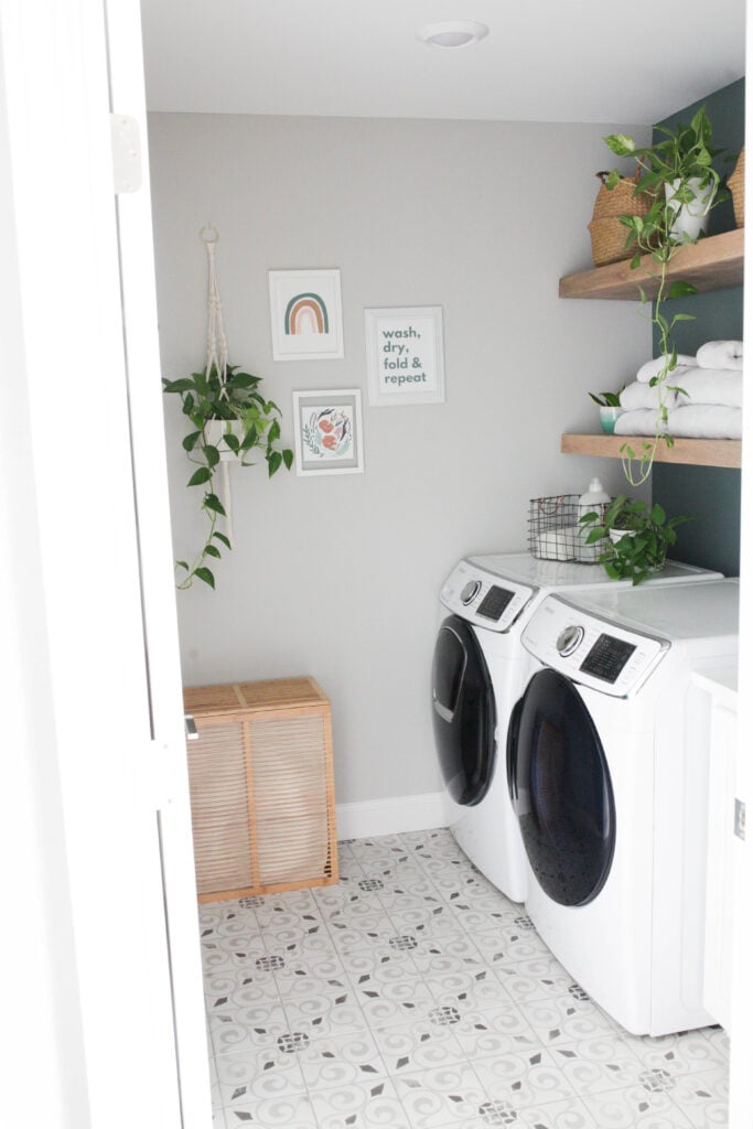 Laundry room with shelves and small gallery wall