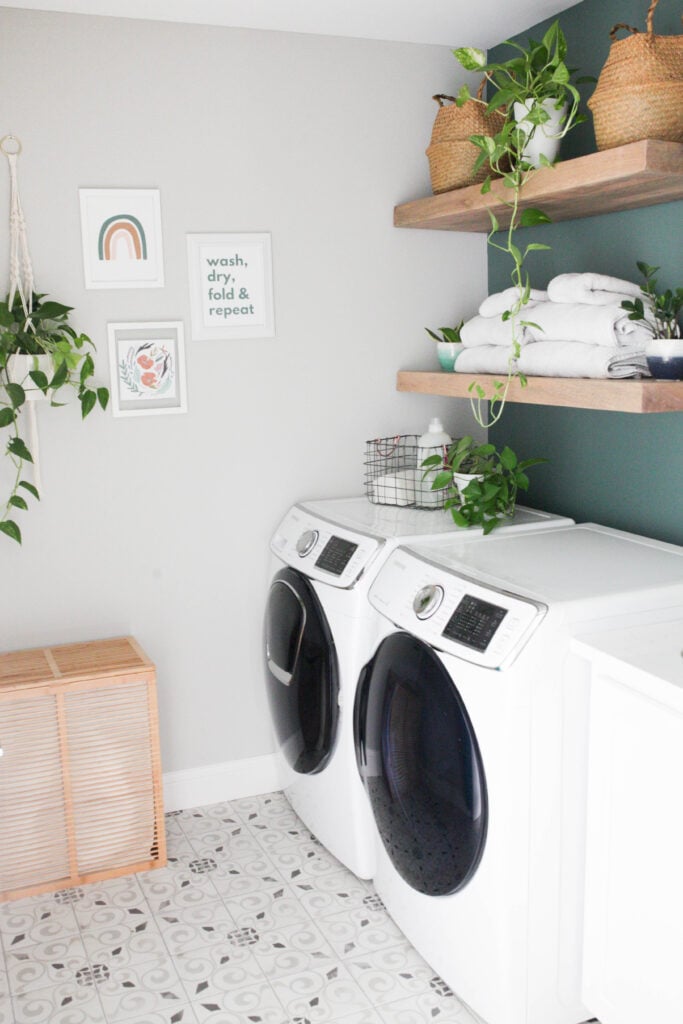 After photo of laundry room with wood shelves and small gallery wall