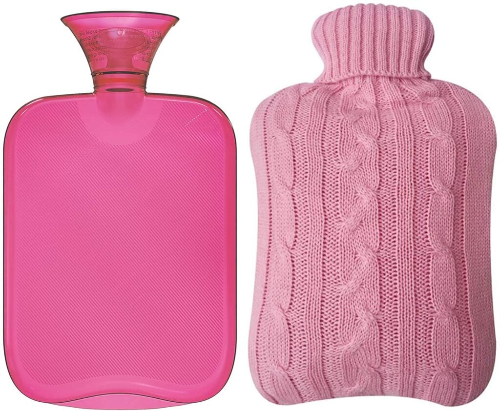 Pink hot water bottle with cable knit cover