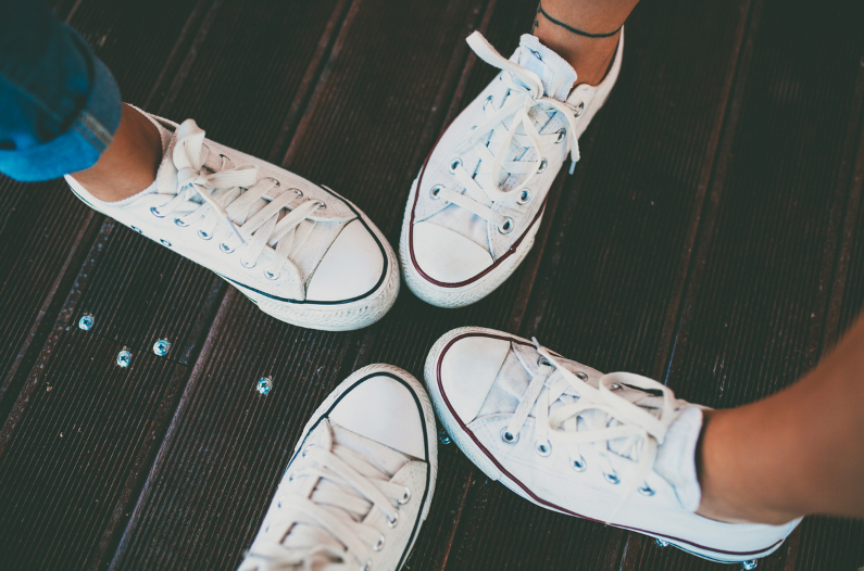 4 white converse sneakers