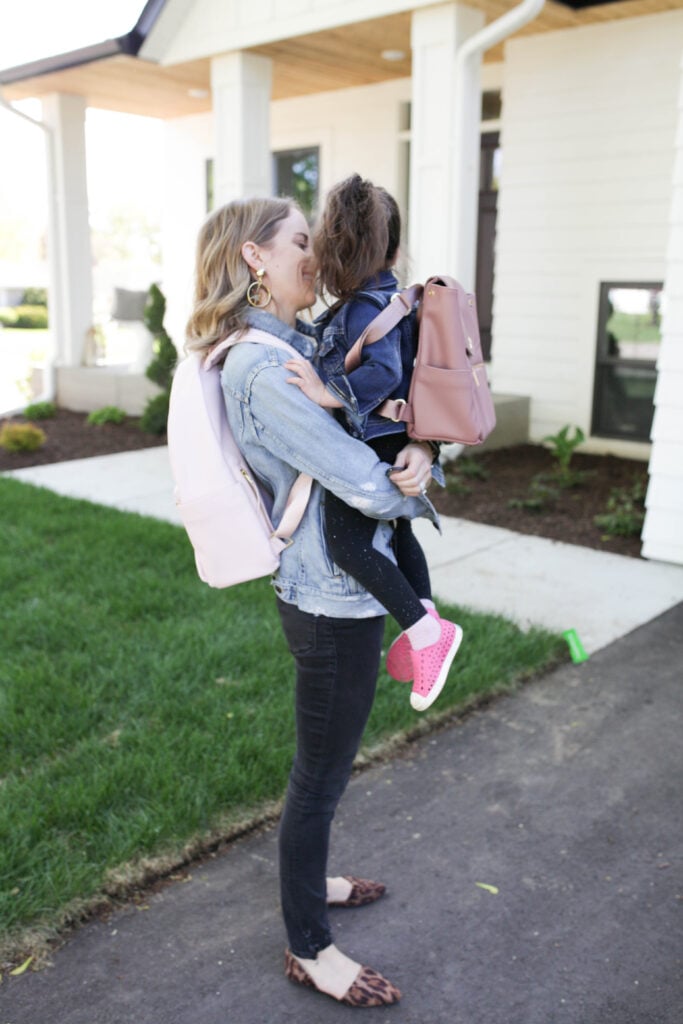 Woman and girl with backpacks