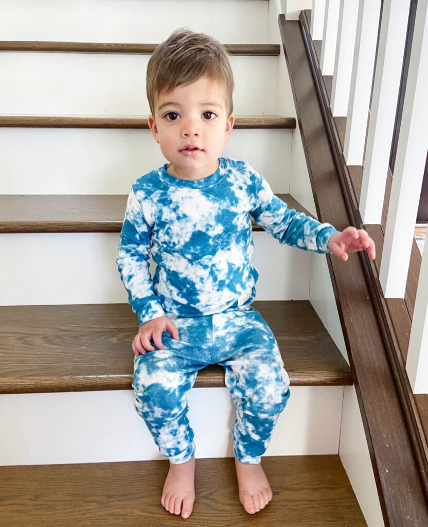 Toddler in two-piece tie-dye pajamas