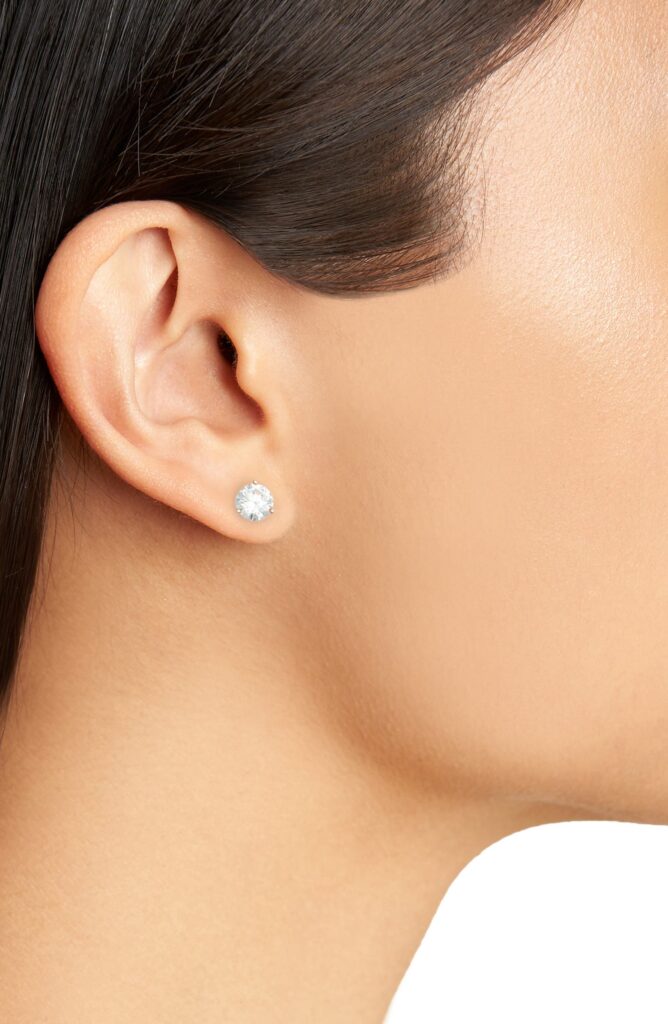Woman wearing cubic zirconia stud earrings