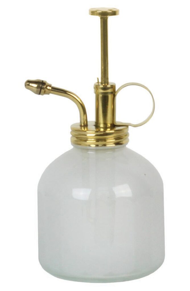 White mister with brass top