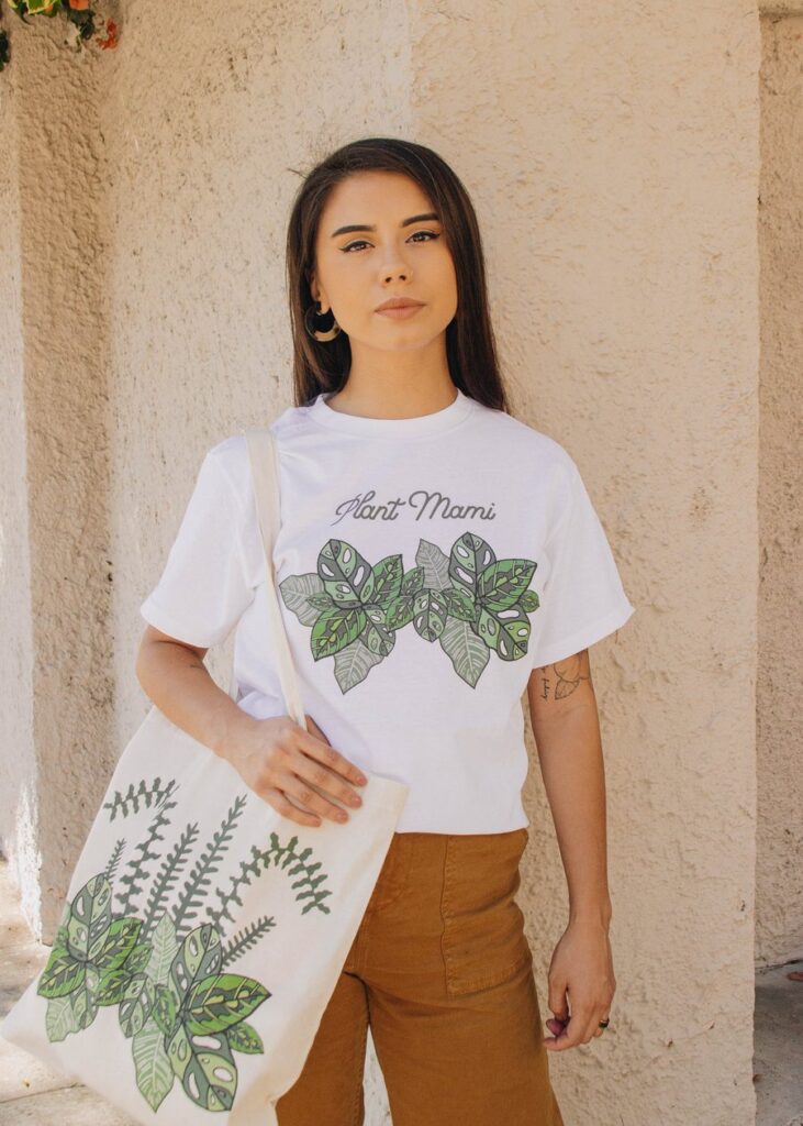Woman wearing Plant Mami T-shirt and carrying plant tote