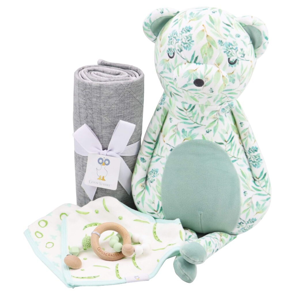 Gift set with blanket, wooden teether and floral patterned stuffed animal