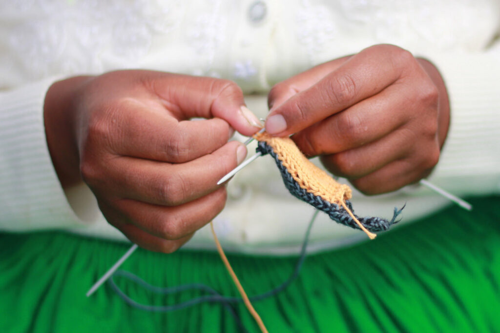 Fair Trade Winds - hands knitting