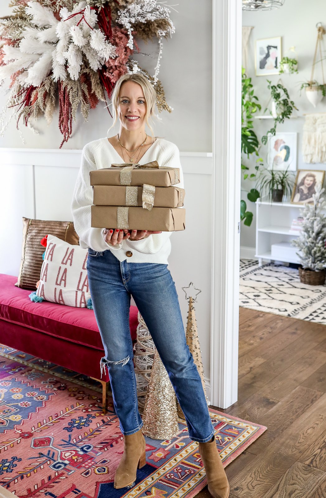 Woman holding wrapped holiday gifts