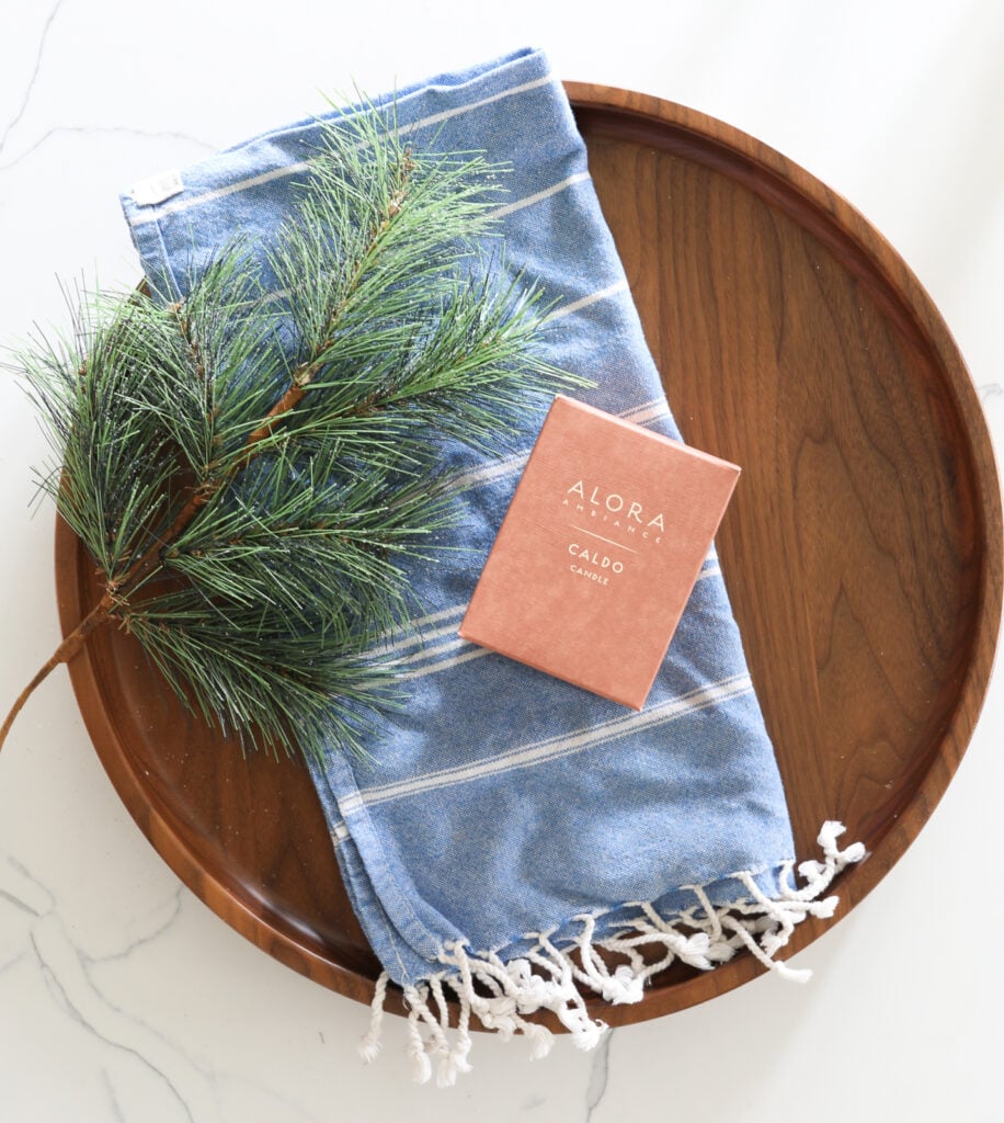 Timber and Tulip tray with candle and towel on it