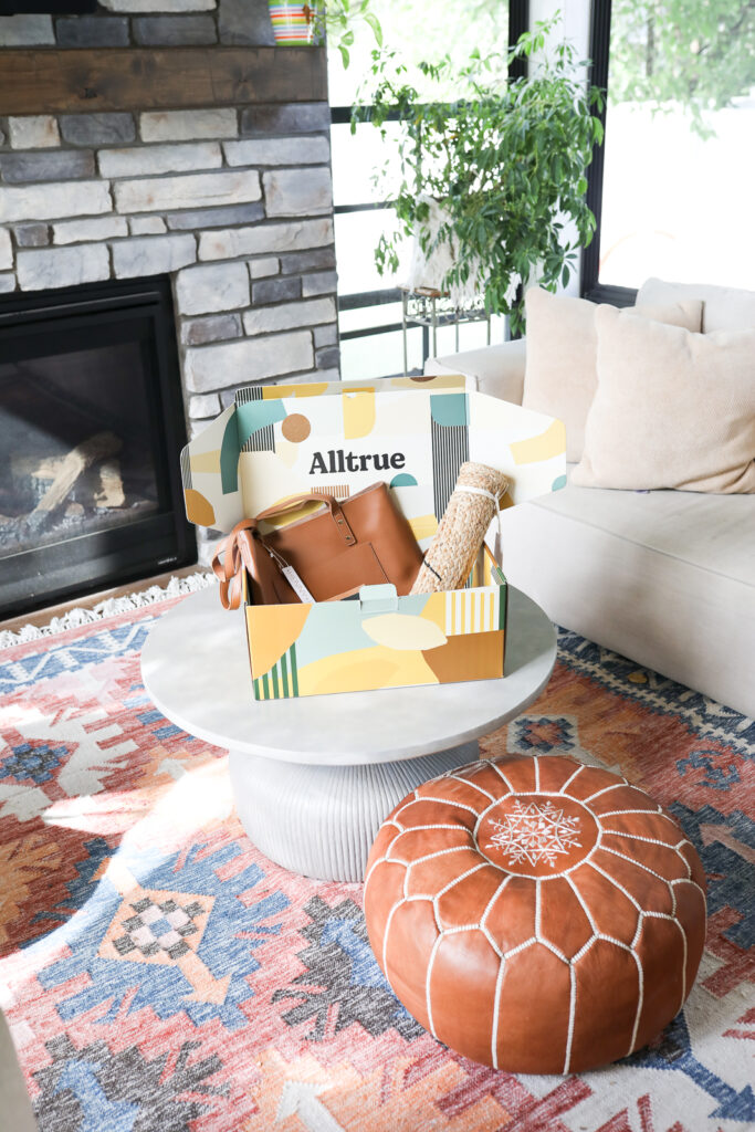 Alltrue subscription box sitting on table in a porch