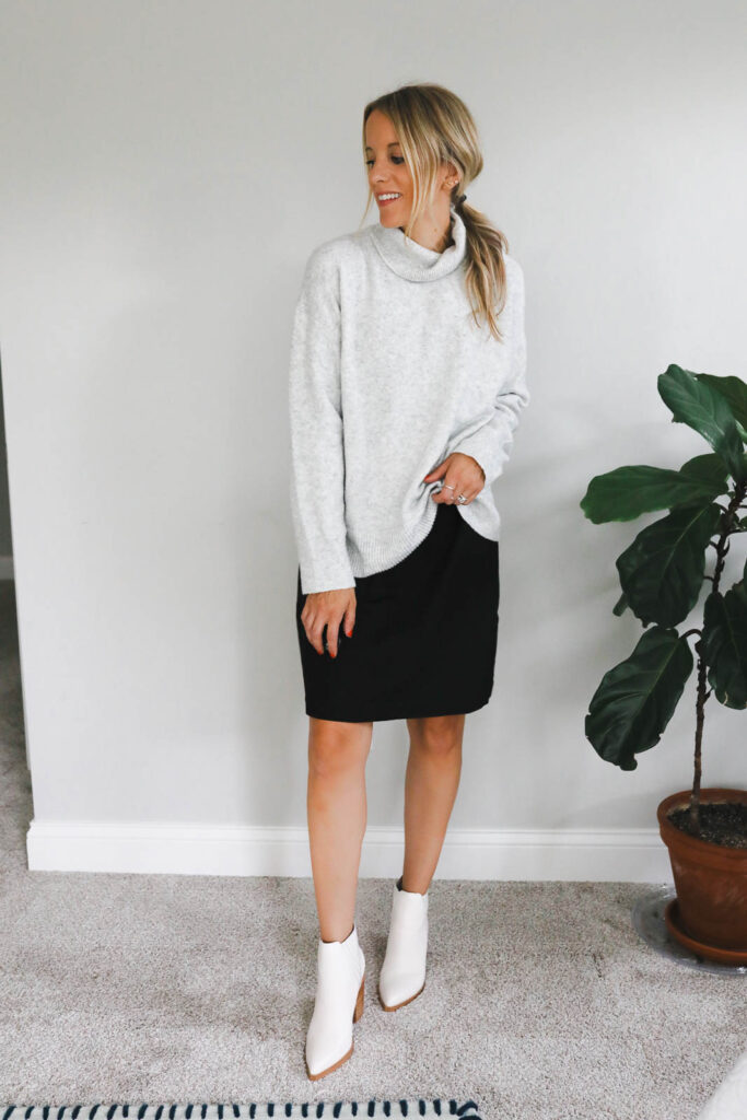 Girl Wearing Shift Dress + Sweater + White Boots Outfit