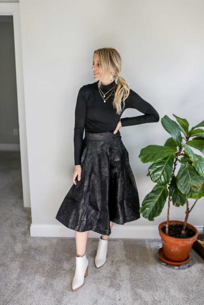 Girl Wearing Midi Skirt + Black Bodysuit