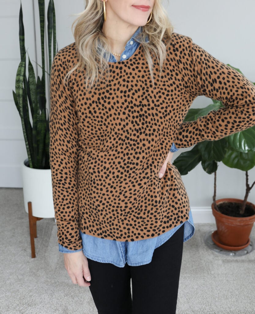 leopard sweater layered over chambray shirt
