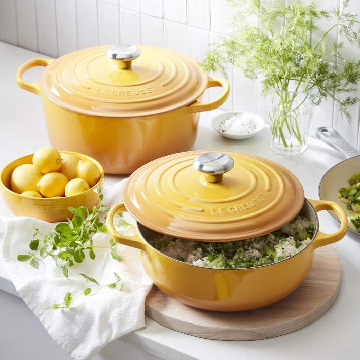 Yellow Le Creuset cookware on a counter