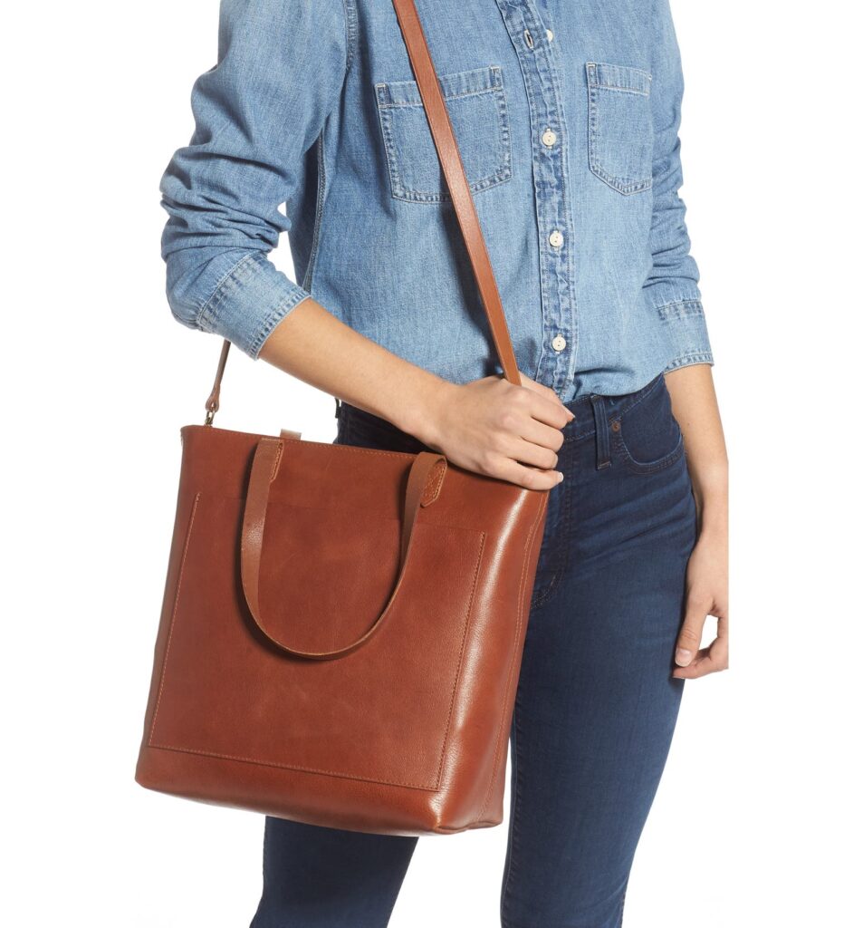 Woman holding leather tote