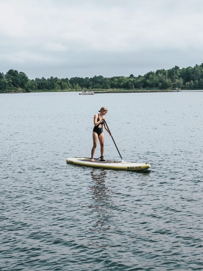 woman stand up paddle boarding'