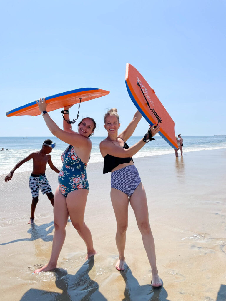 2 moms boogy boarding at the beach