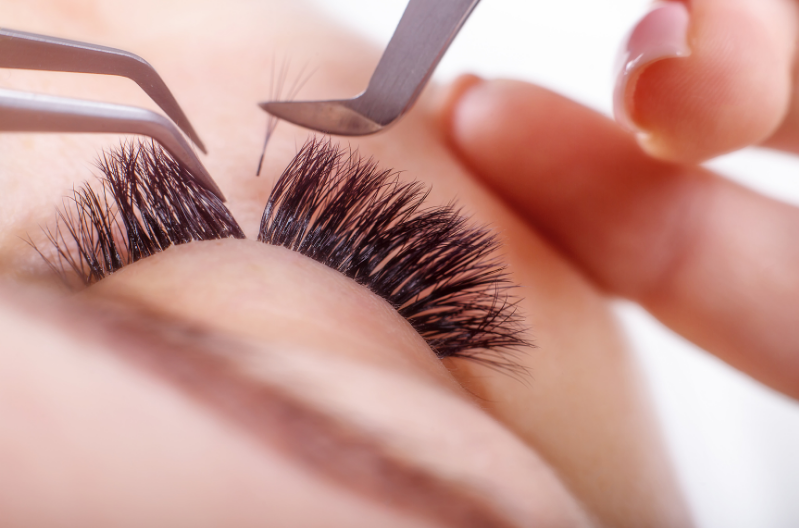 Eyelash extensions being applied