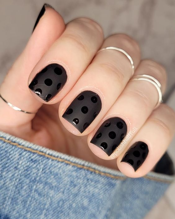 black nails with silver designs