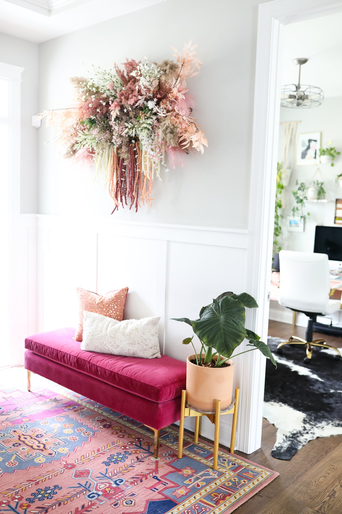 Peach Floral Wall Installation above pink bench