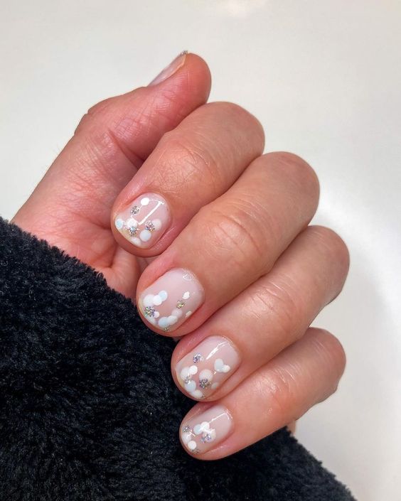 white and nude polka dot nails