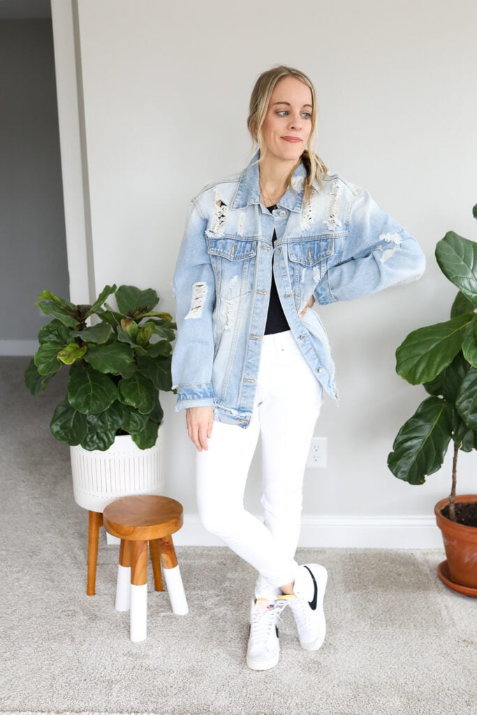 woman wearing white jeans, denim jacket