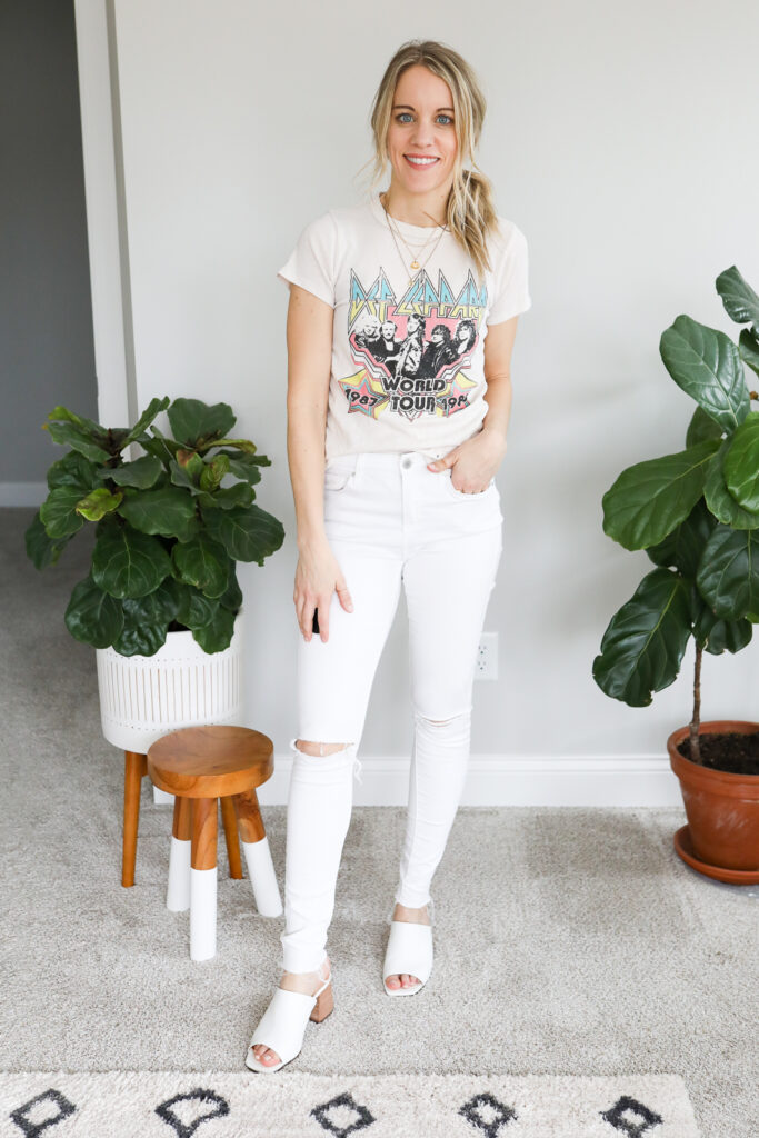 woman wearing white jeans Graphic T-shirt and Sandals
