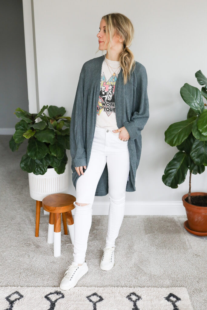 woman wearing White Jeans, Graphic T-Shirt, Cardigan and Sneakers