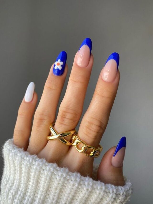 Nails with blue tips with daisy accent