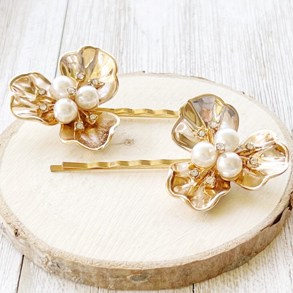 Gold bobbypins with gold, rhinestone and pearl flowers