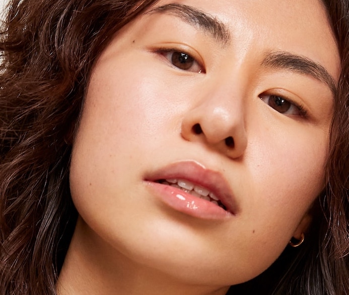 Close-up of woman's face wearing Sephora Collection – Glossed Lip Gloss