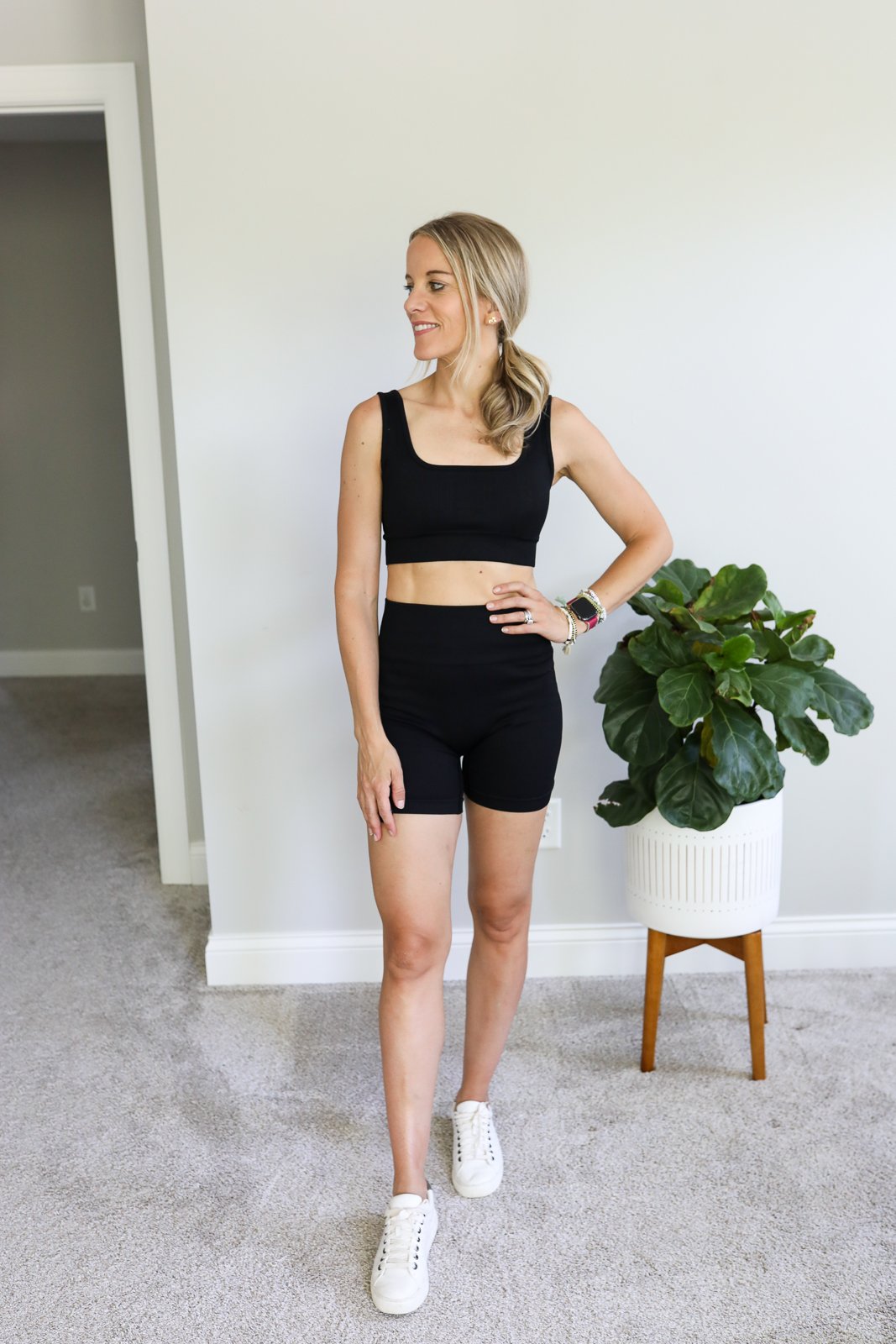 woman wearing black ribbed workout set