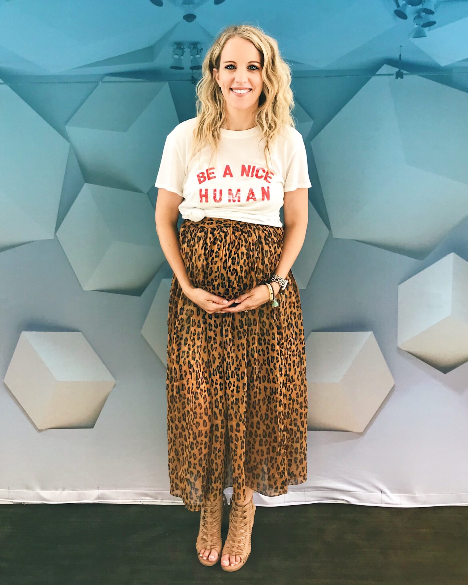 pregnant woman with leopard skirt and crimped hair