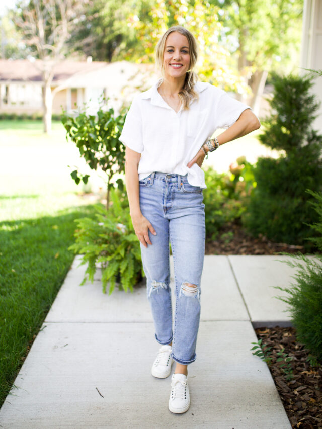 woman in jeans, white sneakers and a white button down