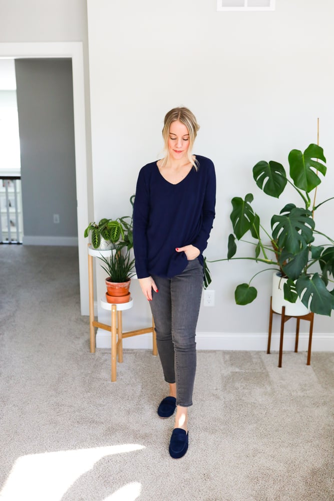 woman wearing grey jeans and loafer